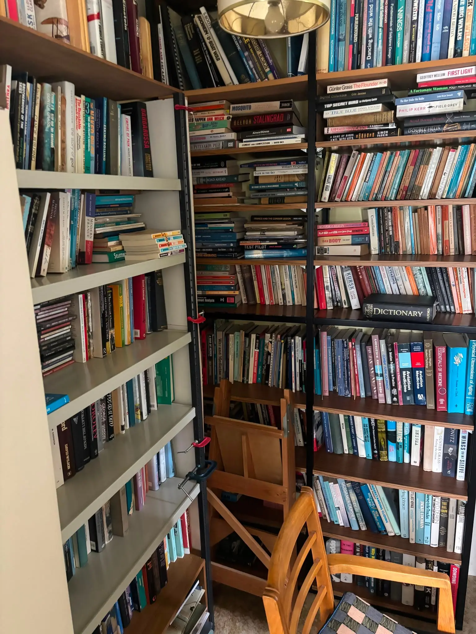 Books and shelving before a flat clearance Room filled with books and shelving before a flat clearance.